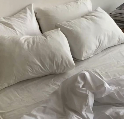 A clean white bed